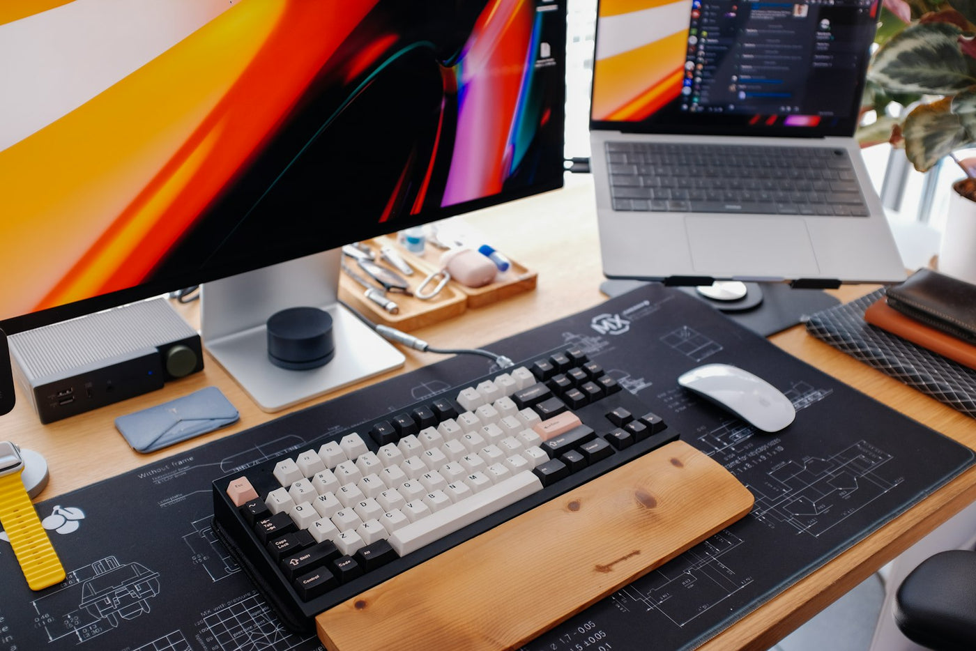 A desk setup with a keyboard and monitor positioned at eye level