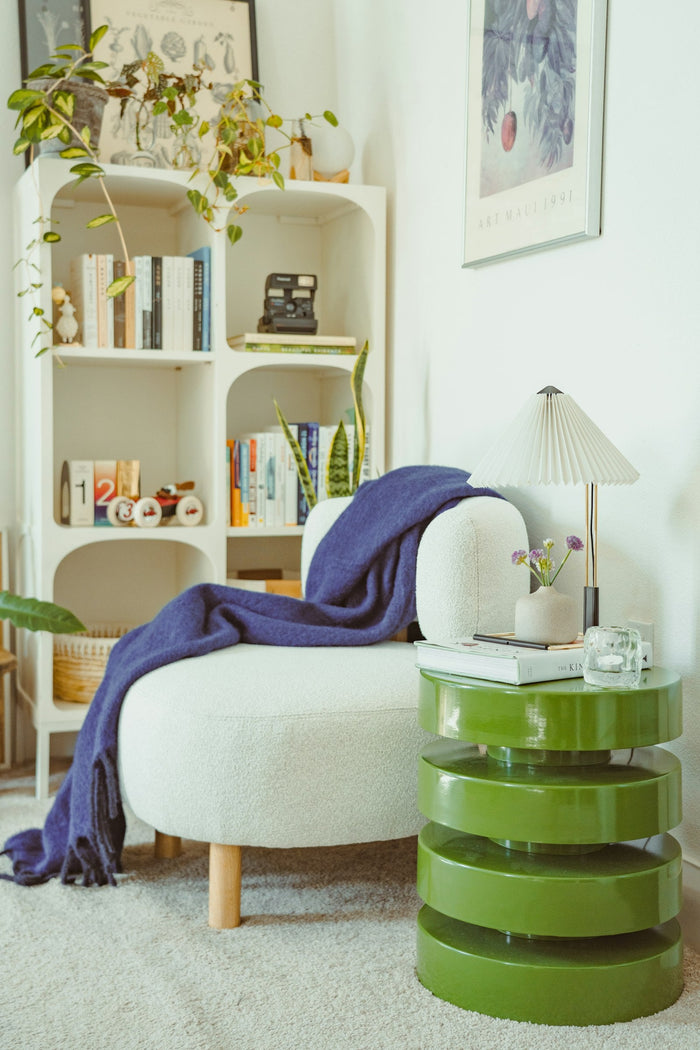 Cozy reading nook with a white chair
